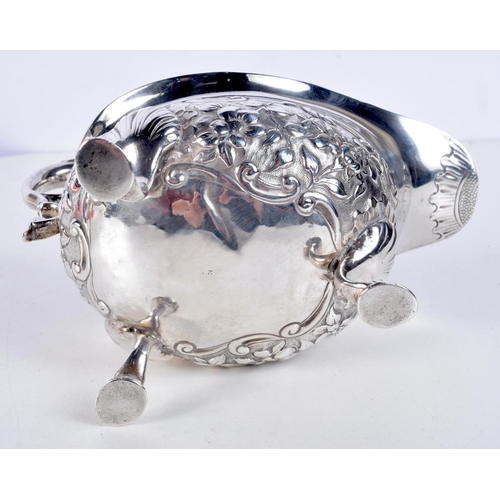 1067 - A LATE VICTORIAN SILVER REPOUSSE SAUCE BOAT by George & Nathan Ridley. Chester 1894. 268 grams. 18 c... 