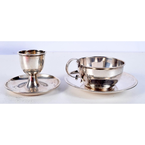 1078 - A RARE SILVER CUP AND SAUCER together with a silver egg cup. Birmingham 1946. 151 grams. Largest 9 c... 