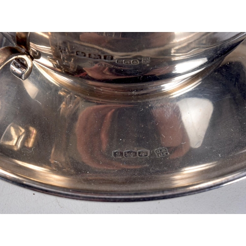 1078 - A RARE SILVER CUP AND SAUCER together with a silver egg cup. Birmingham 1946. 151 grams. Largest 9 c... 