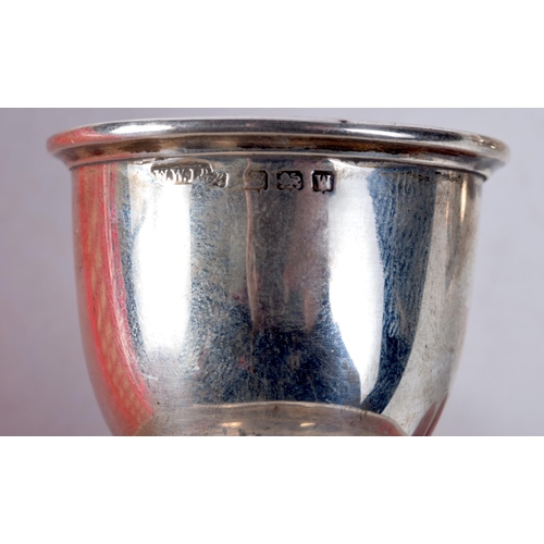 1078 - A RARE SILVER CUP AND SAUCER together with a silver egg cup. Birmingham 1946. 151 grams. Largest 9 c... 