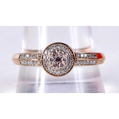 1084 - A 9CT GOLD AND DIAMOND CLUSTER RING. U. 2.4 grams.