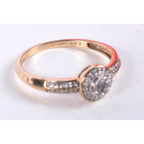 1084 - A 9CT GOLD AND DIAMOND CLUSTER RING. U. 2.4 grams.