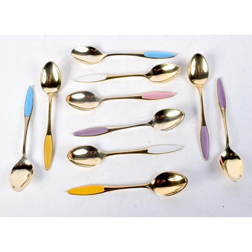 1095 - EIGHT DANISH SILVER GILT AND ENAMEL SPOONS. 92 grams. 9 cm x 1.75 cm. (8)