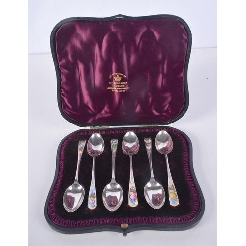 1098 - A CASED SET OF ANTIQUE SILVER AND ENAMEL SPOONS. London 1887. 52 grams. 10 cm long. (6)