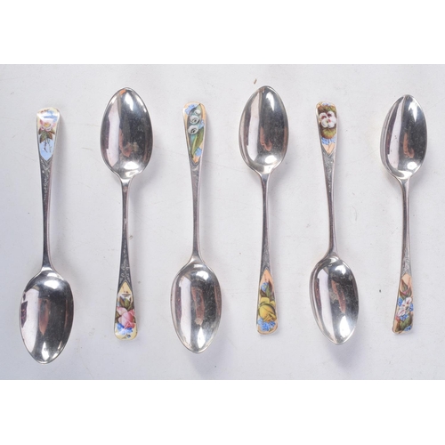 1098 - A CASED SET OF ANTIQUE SILVER AND ENAMEL SPOONS. London 1887. 52 grams. 10 cm long. (6)