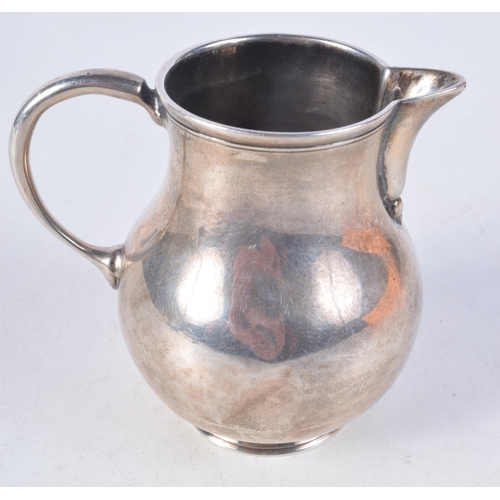 1099 - A GEORGE III SILVER CREAM JUG. 83 grams. 8 cm x 7 cm.