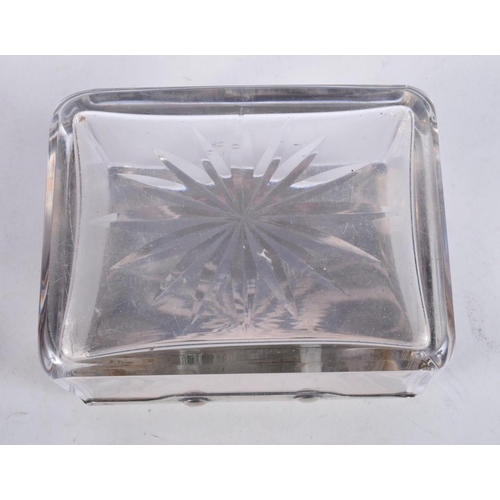 1103 - AN ANTIQUE SILVER MOUNTED GLASS BOX. 10.5 cm x 8 cm.