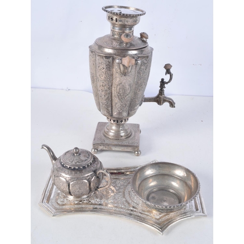 1110 - AN ANTIQUE PERSIAN WHITE METAL KETTLE ON STAND with tray and drinking bowl. 1085 grams. Largest 22 c... 