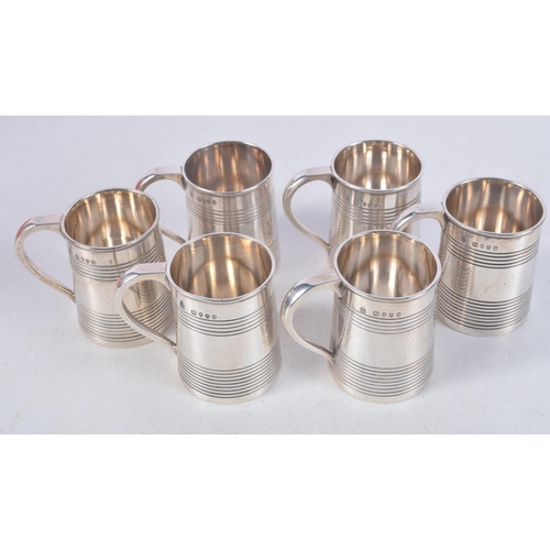 1116 - A RARE SET OF SIX MINIATURE VICTORIAN SILVER MUGS. London 1887. 260 grams. 5.5 cm x 4.5 cm. (6)