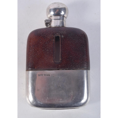 1120 - A 1950S SILVER AND LEATHER HIP FLASK. Sheffield 1950. 348 grams. 14.5 cm x 8.5 cm.