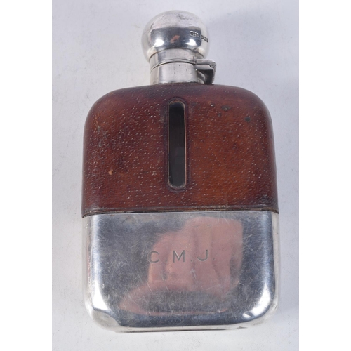 1120 - A 1950S SILVER AND LEATHER HIP FLASK. Sheffield 1950. 348 grams. 14.5 cm x 8.5 cm.