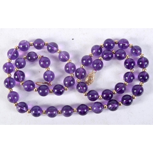 1123 - A 14CT GOLD AND AMETHYST NECKLACE. 31 grams. 45 cm long.