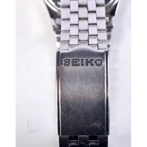 1125 - A SEIKO SQ 100 WRISTWATCH. 3.5 cm wide inc crown.