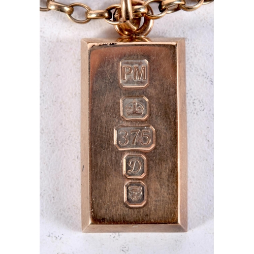 1132 - A 9CT GOLD INGOT NECKLACE upon a 9ct gold chain. 43.7 grams. 52 cm long, pendant 3.5 cm x 1.5 cm.