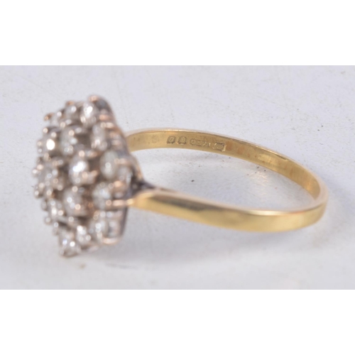 1136 - AN 18CT GOLD AND DIAMOND CLUSTER RING. 4.9 grams. R.