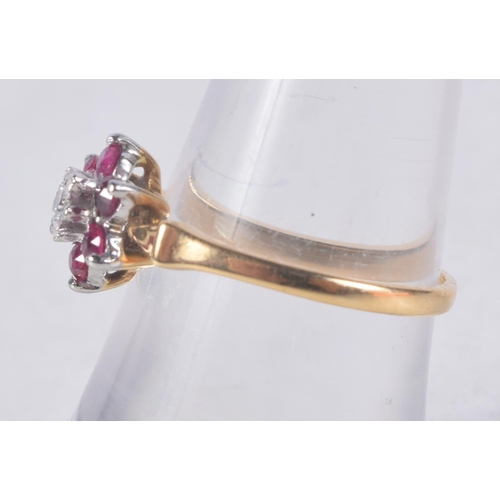 1139 - AN 18CT GOLD DIAMOND AND RUBY CLUSTER RING. 2.3 grams. M.