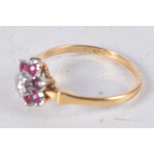 1139 - AN 18CT GOLD DIAMOND AND RUBY CLUSTER RING. 2.3 grams. M.