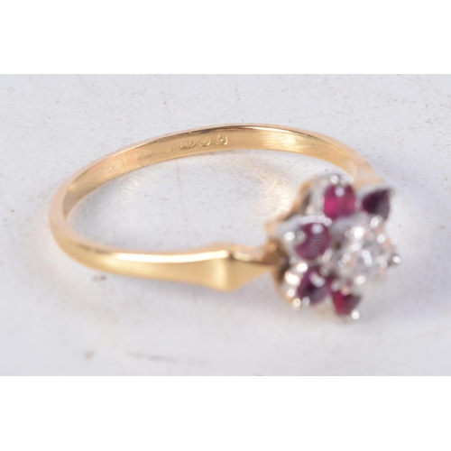 1139 - AN 18CT GOLD DIAMOND AND RUBY CLUSTER RING. 2.3 grams. M.