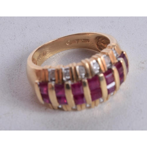 1162 - A 14CT GOLD DIAMOND AND RUBY RING. O. 6.5 grams.