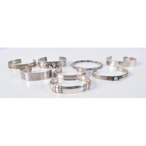 1163 - ASSORTED SILVER BANGLES. 193 grams. Largest 6.5 cm wide. (qty)