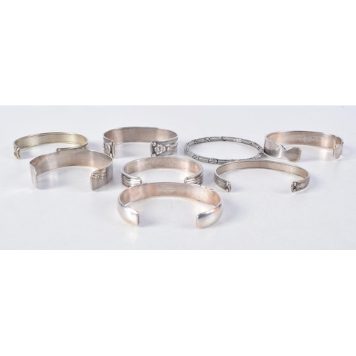 1163 - ASSORTED SILVER BANGLES. 193 grams. Largest 6.5 cm wide. (qty)