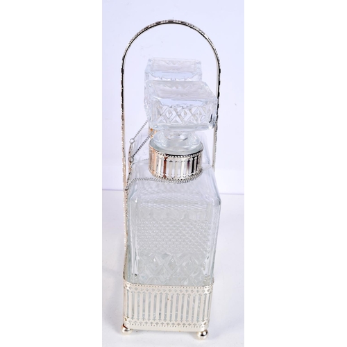 1191 - A SILVER PLATED CUT GLASS TWIN DECANTER SET with labels. 32 cm x 15 cm.