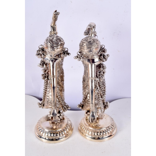 1193 - A PAIR OF VINTAGE MIDDLE EASTERN INDIAN SILVER FIGURES OF DANCERS. 612 grams. 23 cm high.