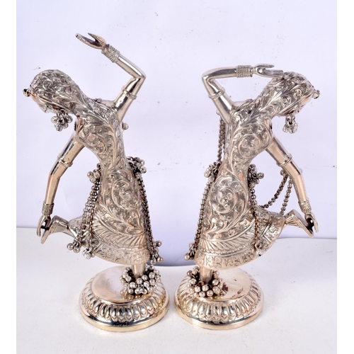 1193 - A PAIR OF VINTAGE MIDDLE EASTERN INDIAN SILVER FIGURES OF DANCERS. 612 grams. 23 cm high.