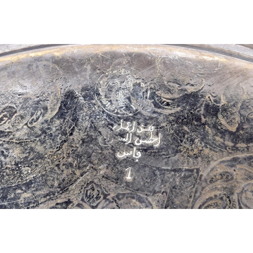 1196 - A LARGE EARLY 20TH CENTURY MIDDLE EASTERN ISLAMIC SLVER PLATED TRAY decorated with foliage and vines... 