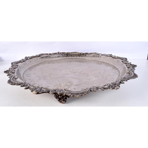 1196 - A LARGE EARLY 20TH CENTURY MIDDLE EASTERN ISLAMIC SLVER PLATED TRAY decorated with foliage and vines... 