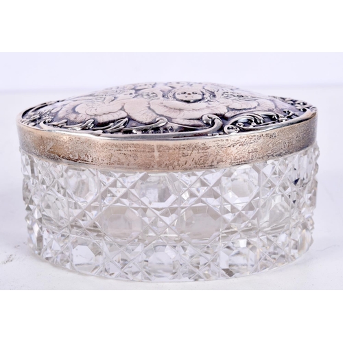 1206 - AN EDWARDIAN SILVER TOPPED CUT GLASS BOX AND COVER. Silver 23 grams. 10 cm x 7 cm.