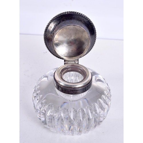 1207 - A VINTAGE SILVER CUT GLASS INKWELL. 824 grams overall. 9 cm wide.