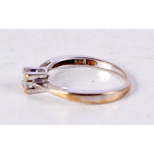 1223 - AN 18CT GOLD AND DIAMOND FOUR STONE RING. O. 2.1 grams.