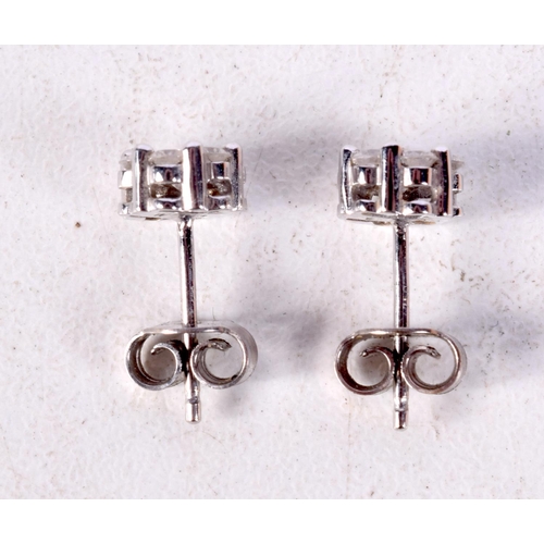 1226 - A PAIR OF 18CT GOLD DIAMOND CLUSTER EARRINGS. 2.1 grams. 0.6 cm wide.