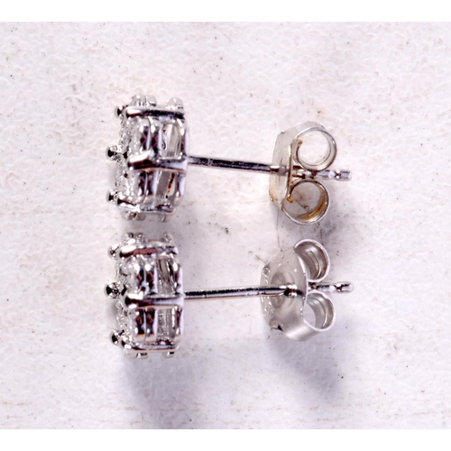 1227 - A PAIR OF SILVER AND DIAMOND EARRINGS. 1.5 grams. 0.7 cm wide.