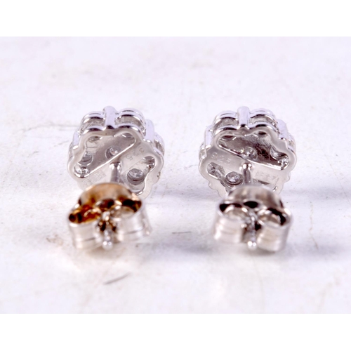 1227 - A PAIR OF SILVER AND DIAMOND EARRINGS. 1.5 grams. 0.7 cm wide.