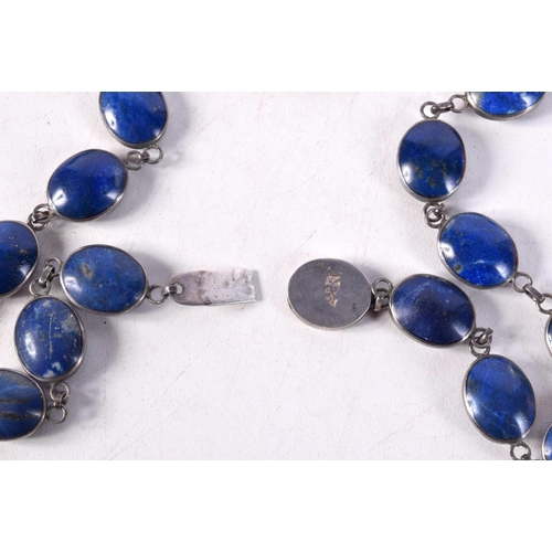 1231 - A SILVER MOUNTED LAPIS LAZULI NECKLACE. 57 grams. 64 cm long.