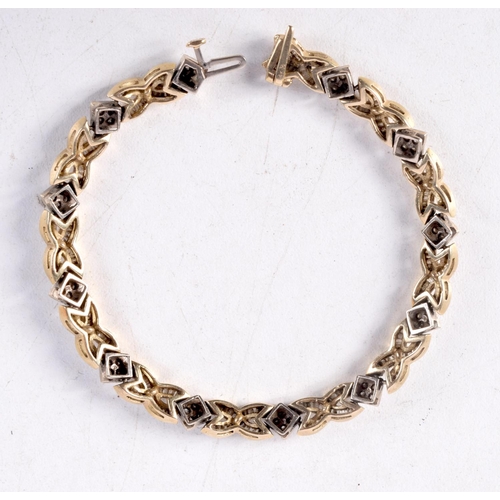 1242 - A 14CT GOLD AND DIAMOND BRACELET. 19 grams. 19 cm long.