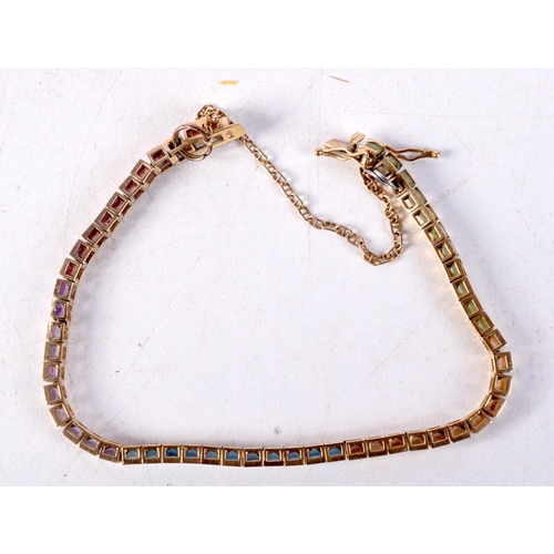 1243 - A 14CT GOLD MULTI STONE BRACELET. 105 grams. 15 cm long.