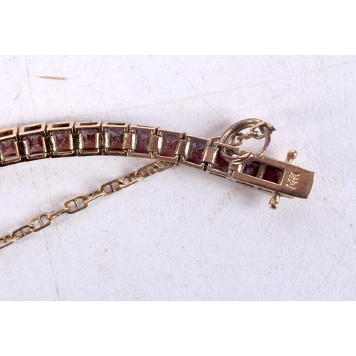 1243 - A 14CT GOLD MULTI STONE BRACELET. 105 grams. 15 cm long.