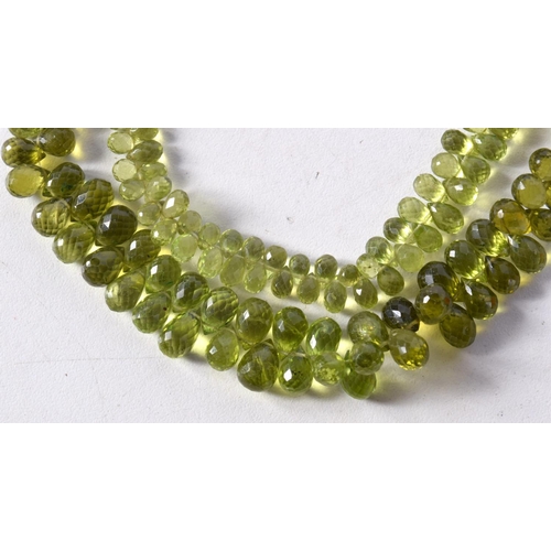 1244 - A PERIDOT BEAD NECKLACE. 70 cm long.