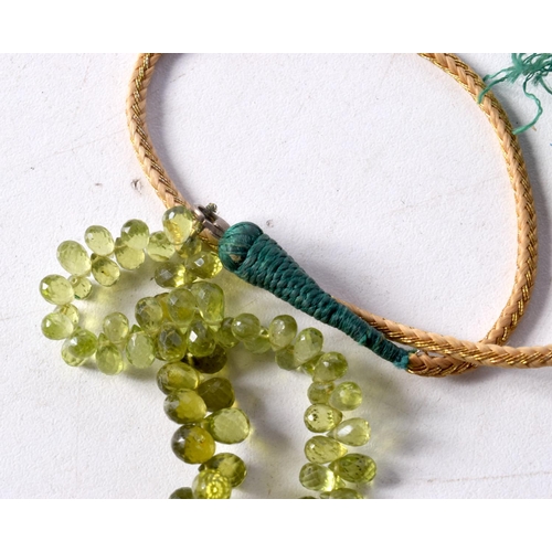 1244 - A PERIDOT BEAD NECKLACE. 70 cm long.