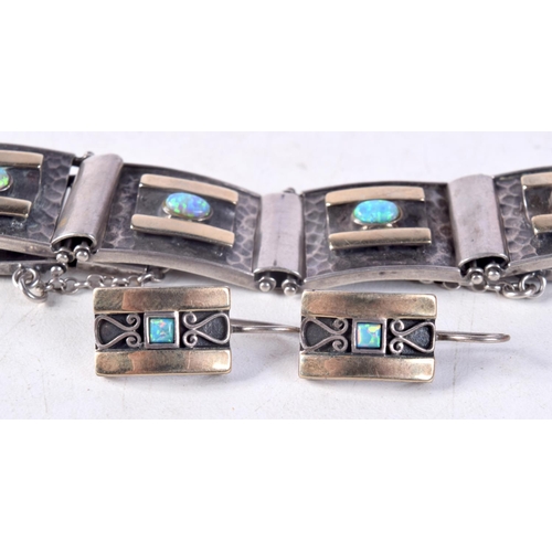 1249 - A VINTAGE SILVER AND OPAL BRACELET with matching earrings. 40.5 grams. Bracelet 5.5 cm internal widt... 