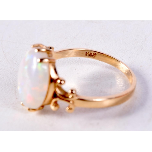 1253 - A 14CT GOLD AND OPAL RING. 2.5 grams. L.