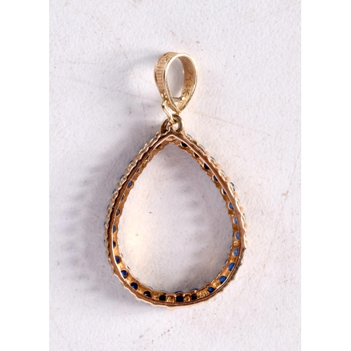 1265 - A 14CT GOLD AND SAPPHIRE PENDANT. 2.3 grams. 3 cm x 1.75 cm.