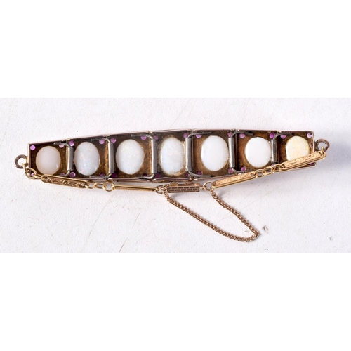 1272 - A GOOD GOLD OPAL AND RUBY BRACELET. 16.5 grams. 16.5 cm long.