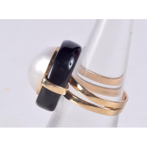 1273 - A 14CT GOLD AND PEARL RING. L/M. 7.3 grams.