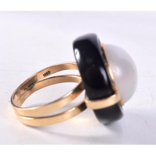 1273 - A 14CT GOLD AND PEARL RING. L/M. 7.3 grams.