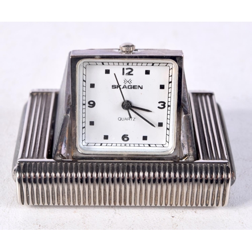 1298 - A VINTAGE SILVER PURSE WATCH. 5 cm x 3.5 cm.