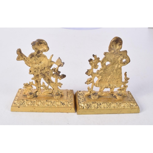 1303 - A PAIR OF LATE 19TH CENTURY GILT METAL FIGURES. 9.5 cm x 8 cm.